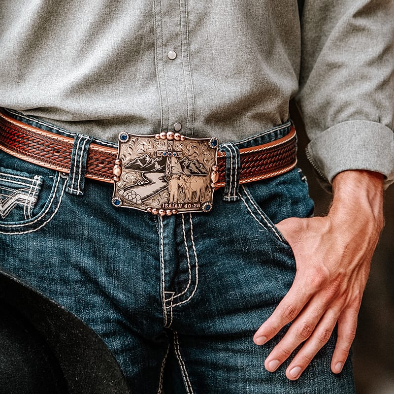 Custom Belt Buckles - Man wearing a customized belt buckle with a landscape